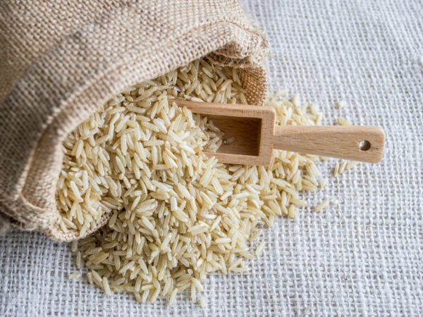 Brown rice in burlap bag