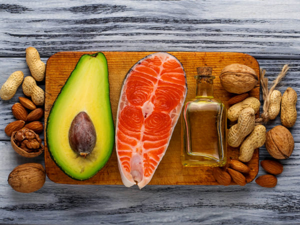 Healthy fat salmon, avocado, oil, nuts. Selective focus