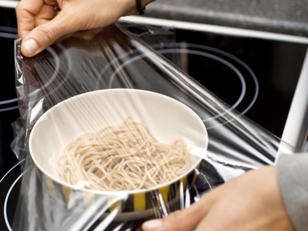 human hand conserves noodels with plastic