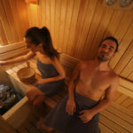 Young couple is relaxing in the sauna. High angle view.