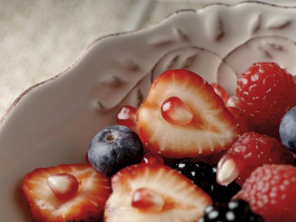 Bowl full of red fruits