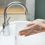 hands being washed with soap.