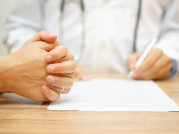 hands of Concerned Women for a medical report written by a doctor on the medical condition