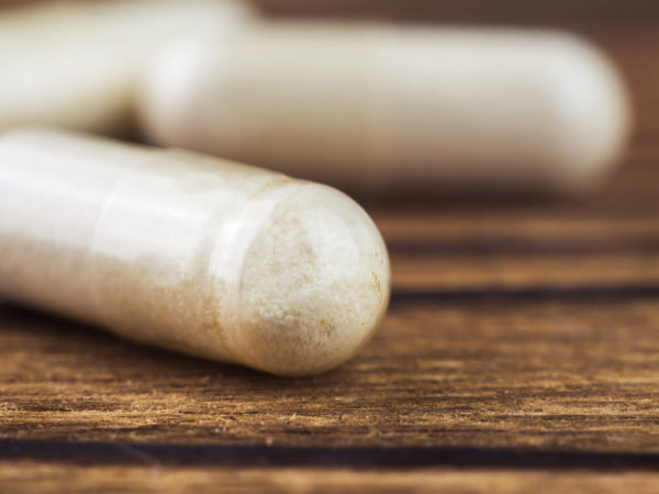 Food supplement pills, glucosamine capsules, macro image, selective focus