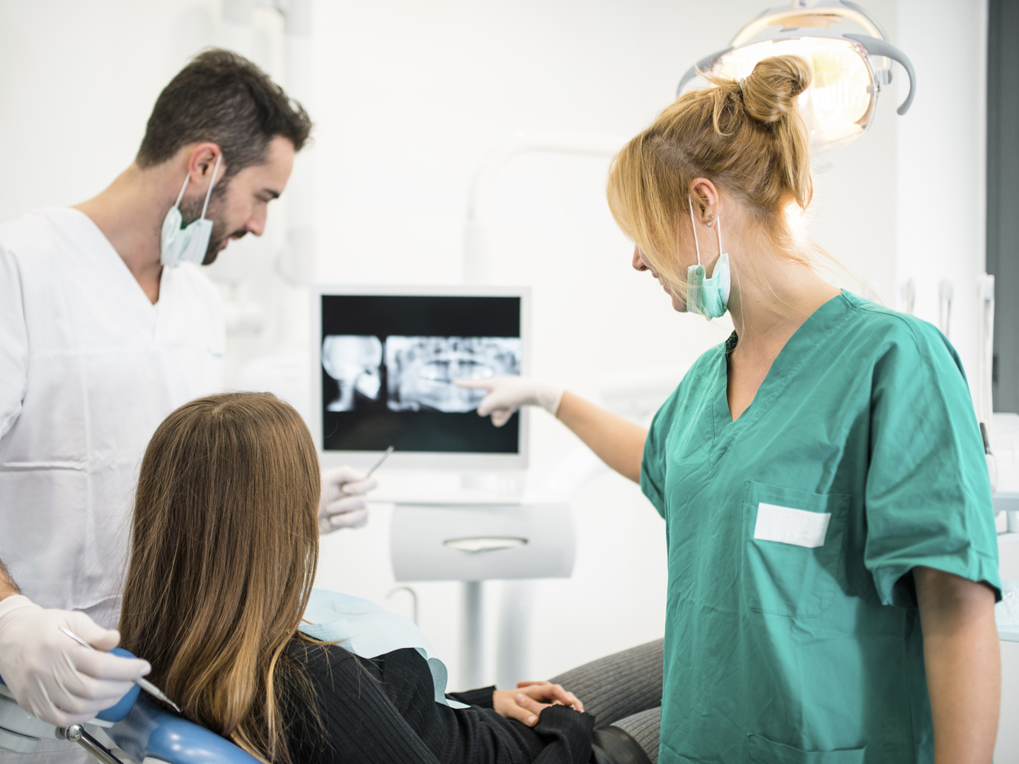 dentist doctor with the assistant in the clinic