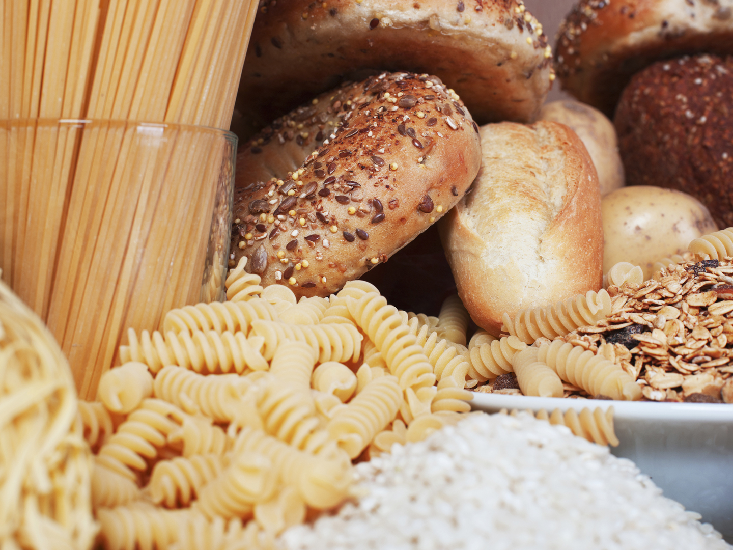 Food high in carbohydrates,, rice,, pasta,, cereal,, bread,, bagel,, noodle.