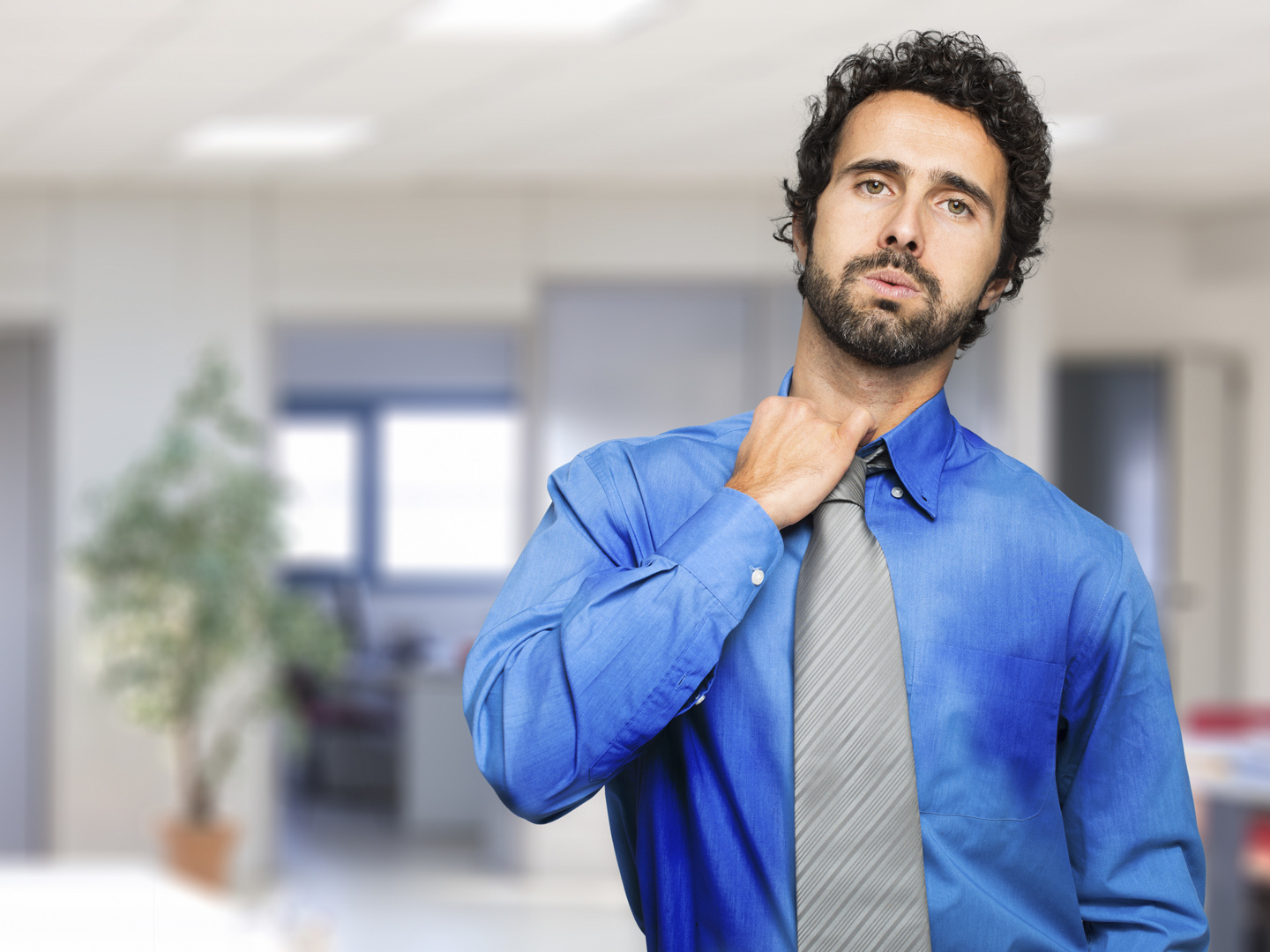 Sweating businessman due to hot climate