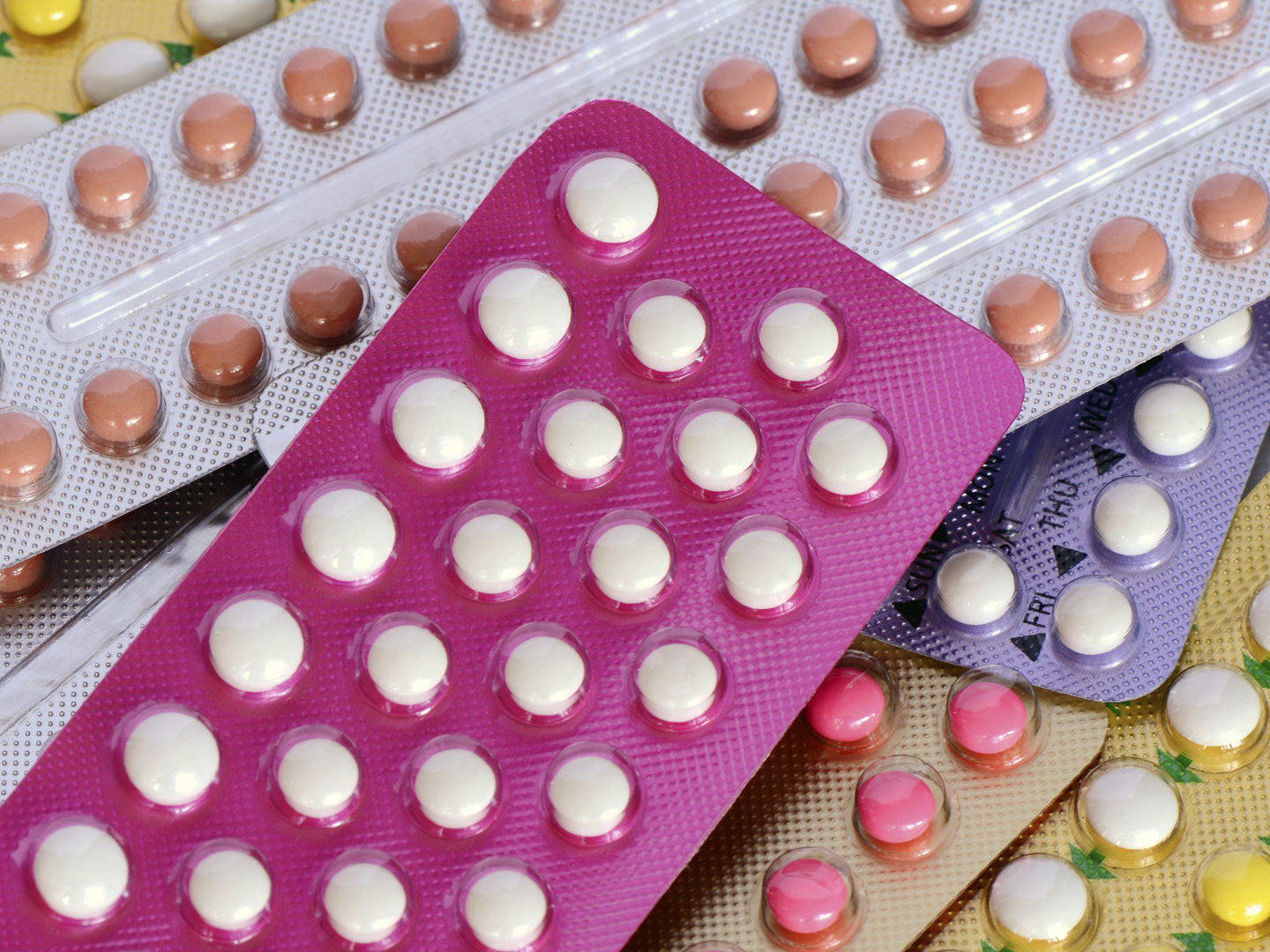 Colorful oral contraceptive pill both 21 and 28 tablets strips.