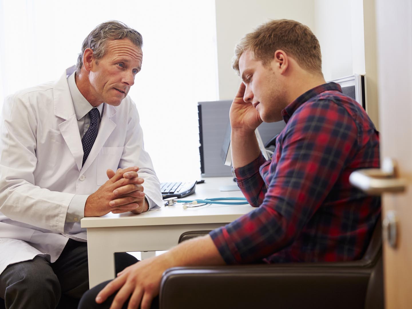 Doctor Treating Male Patient Suffering With Depression