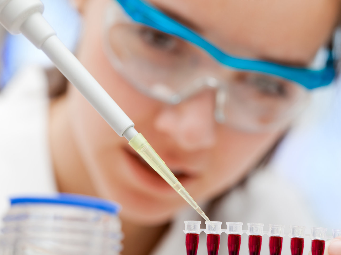 laboratory assistant analyzing a blood sample