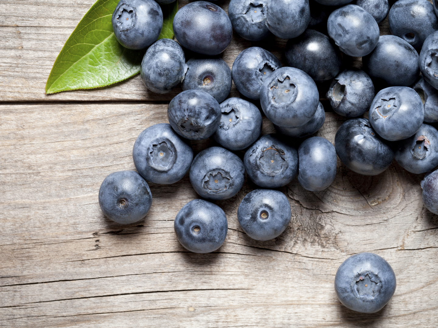 Close up of delicious blueberry on old table. This file is cleaned and retouched.