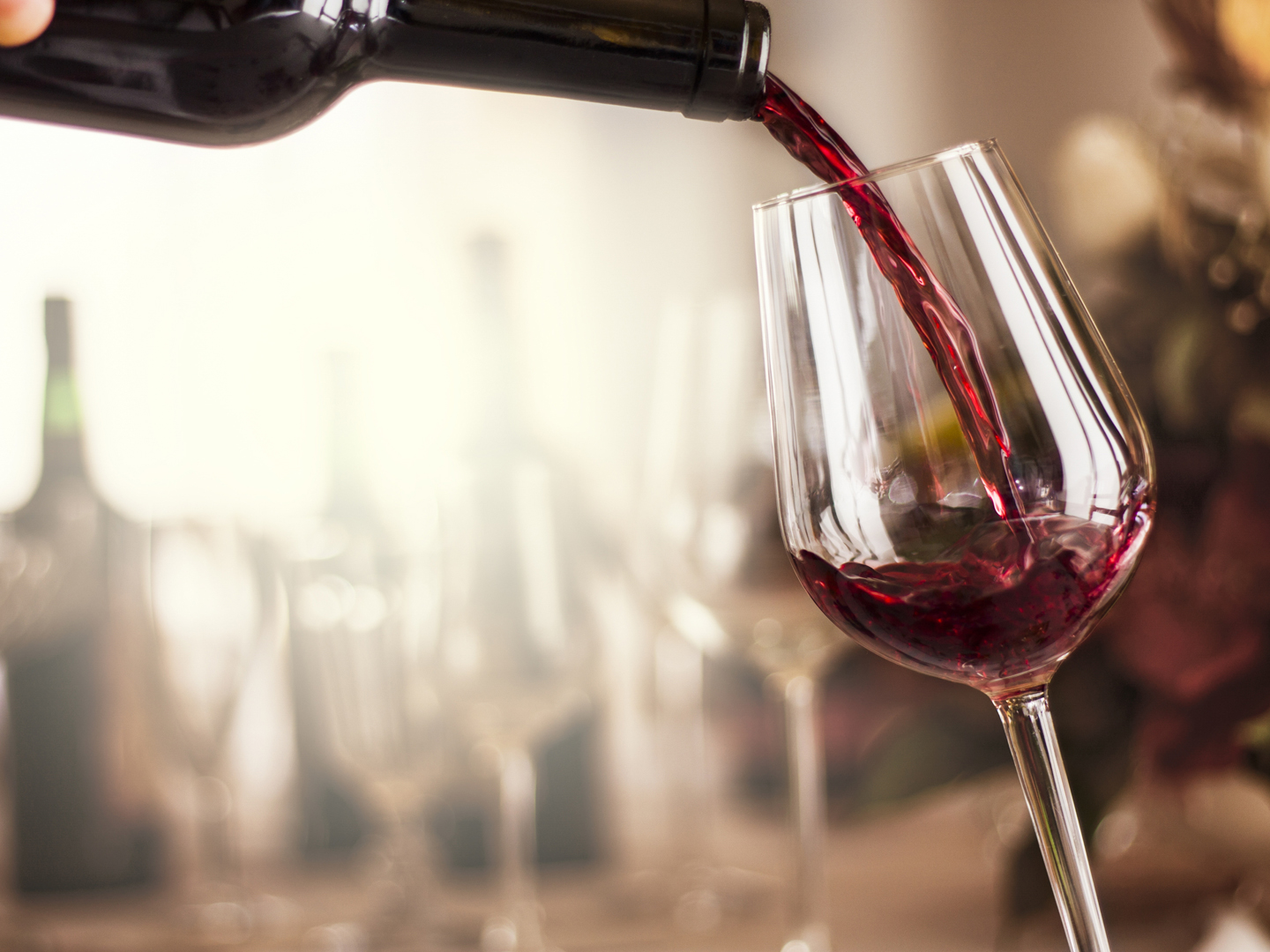 red wine pouring in a restaurant