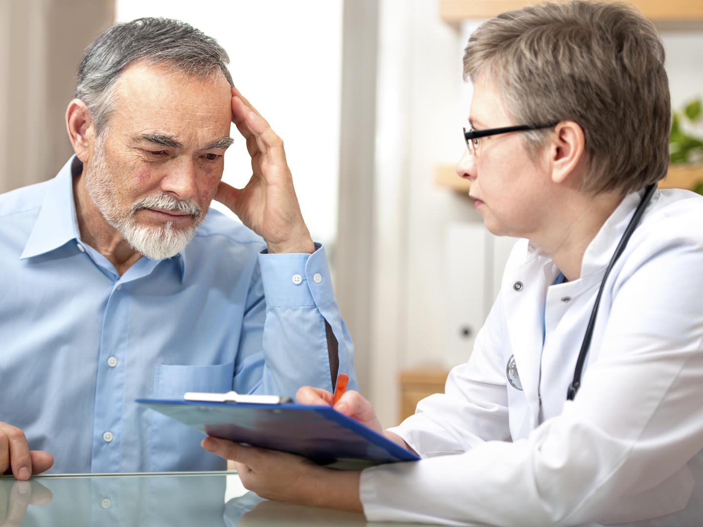 Male patient tells the doctor about his health complaintsPlease see similar images here: